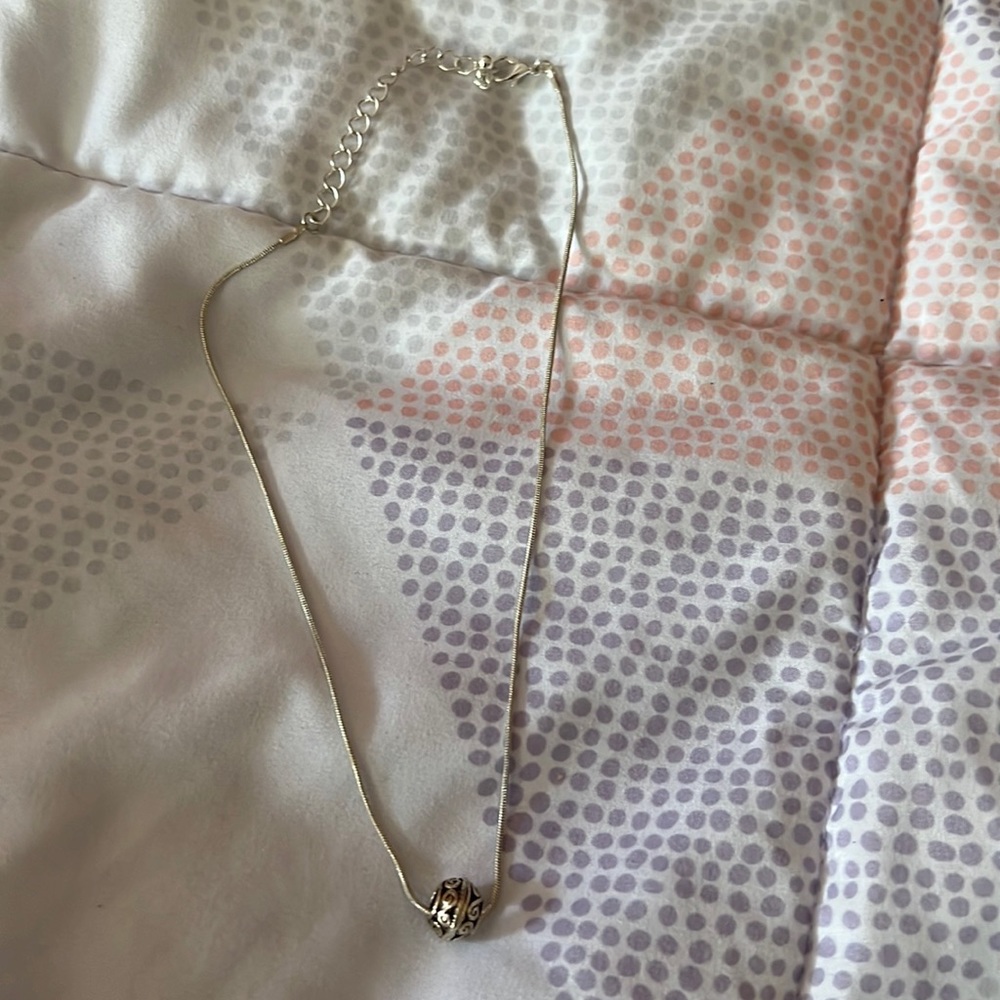 Silver tone necklace with pandora like charm